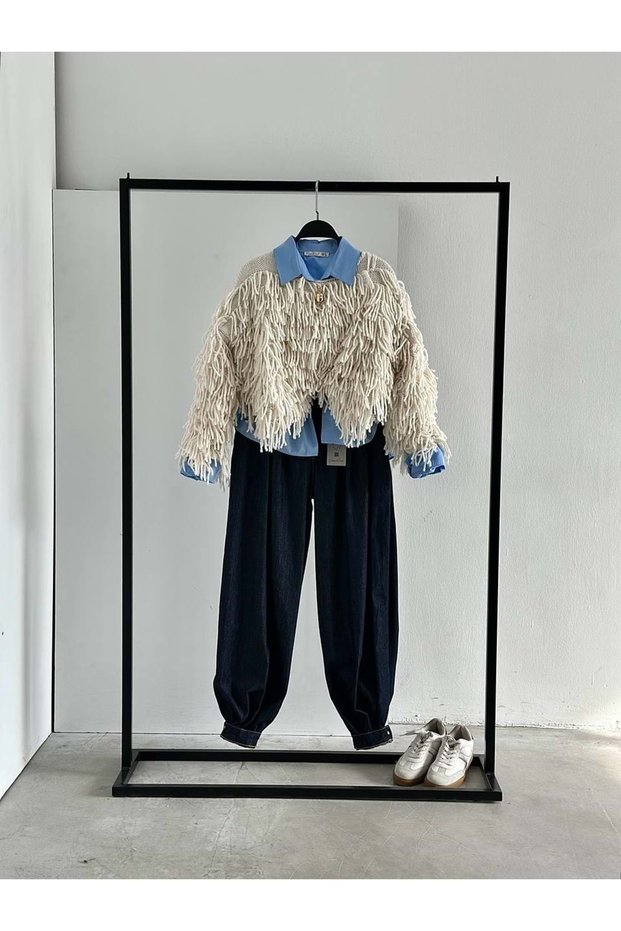 Women's clothing trend: cream-colored tassel sweater