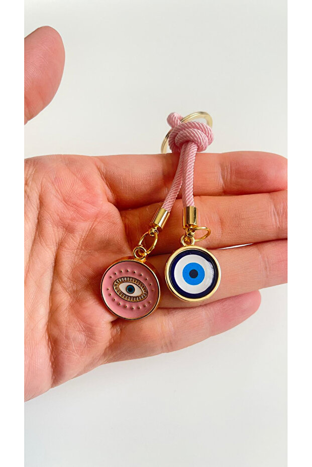 سلسلة مفاتيح على شكل عين دائرية باللون الوردي الفاتح - 2