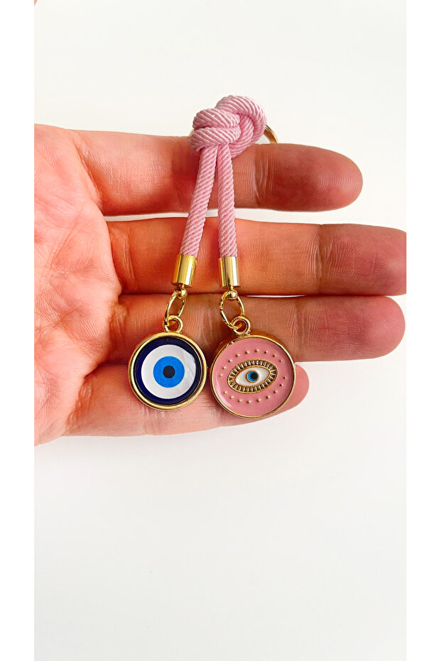 سلسلة مفاتيح على شكل عين دائرية باللون الوردي الفاتح - 1