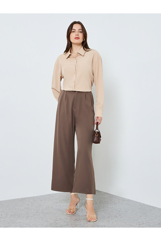 قميص فضفاض بأكمام طويلة بلون موحد - 2