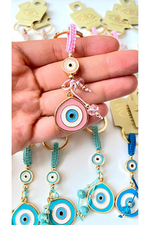 سلسلة مفاتيح على شكل عين الحسد باللون الوردي - 1