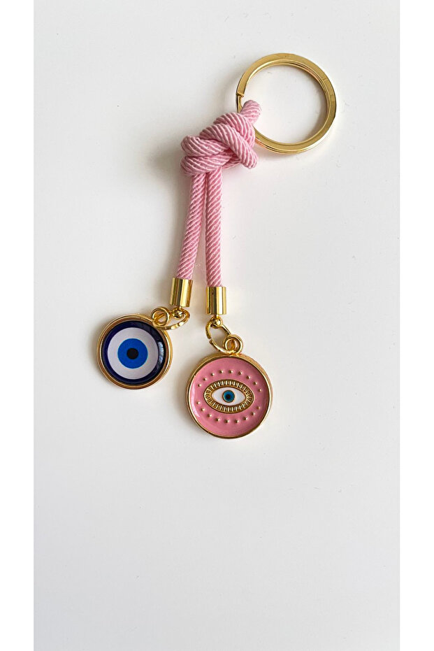 سلسلة مفاتيح على شكل عين دائرية باللون الوردي الفاتح - 4