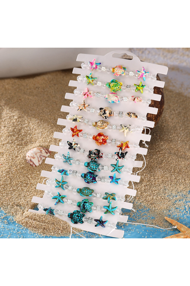 مجموعة أساور مطاطية منسوجة بتصميم نجم البحر والسلحفاة (لون عشوائي) - 12 قطعة جديدة