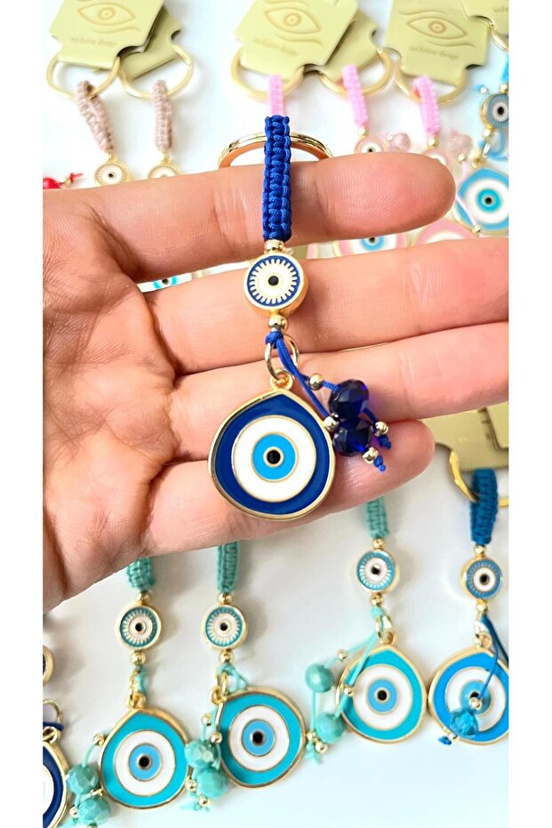 سلسلة مفاتيح على شكل عين الحسد باللون الأزرق الداكن - 1