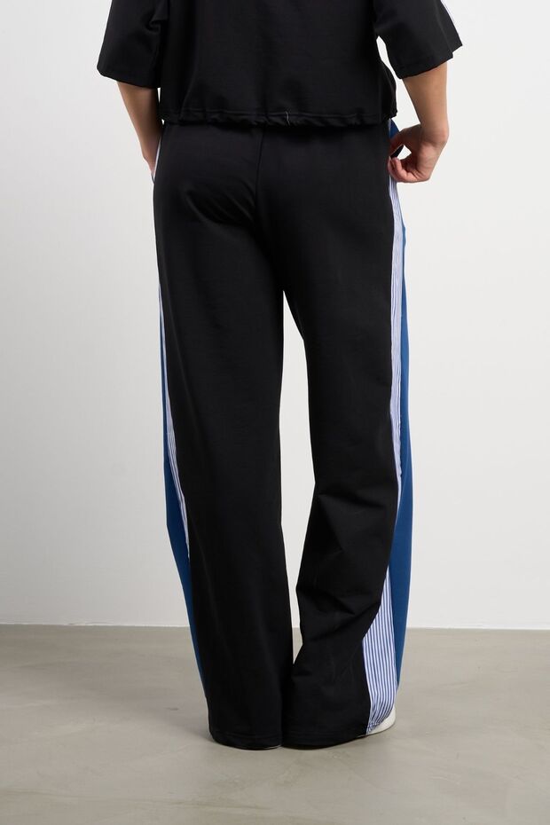 بقطع قماش مخيطة معاً بنطال رياضي مخطط - 2