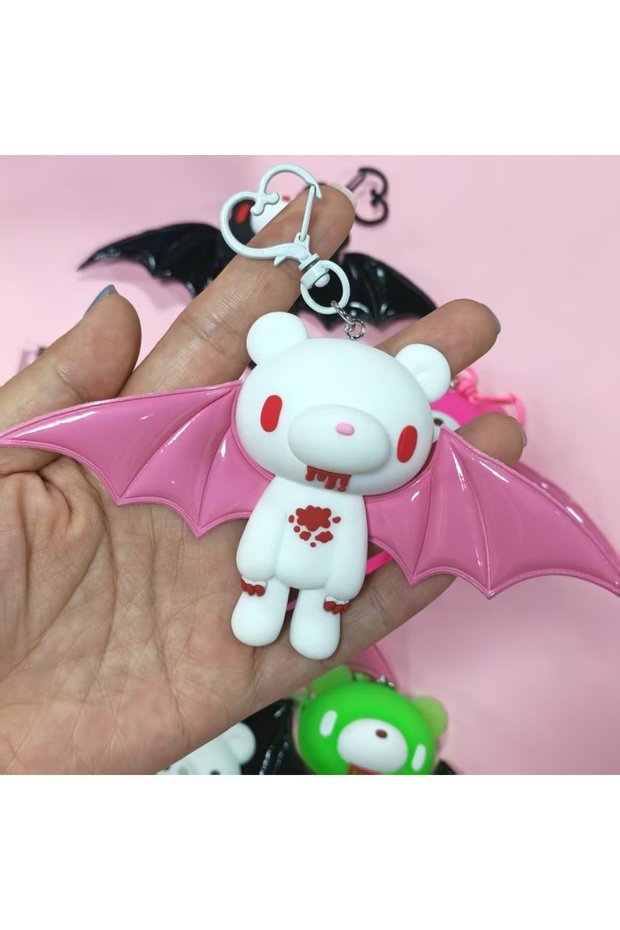 WHITE B These cute bear keychains with bat wings are awesome! In colors like black, pink, white, and