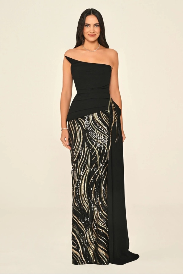 A long crepe dress embellished with sequins, featuring an asymmetrical design and a strapless top. - 1