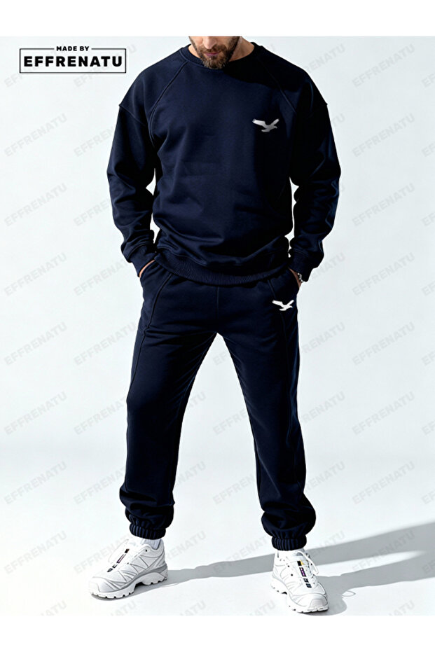 The Hoodless, Navy Blue Tracksuit Is Designed with Original Prints.