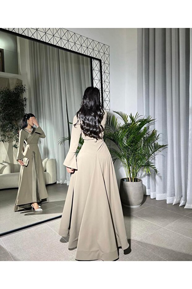 An elegant dress with a modern design that combines sophistication and modesty. - 5