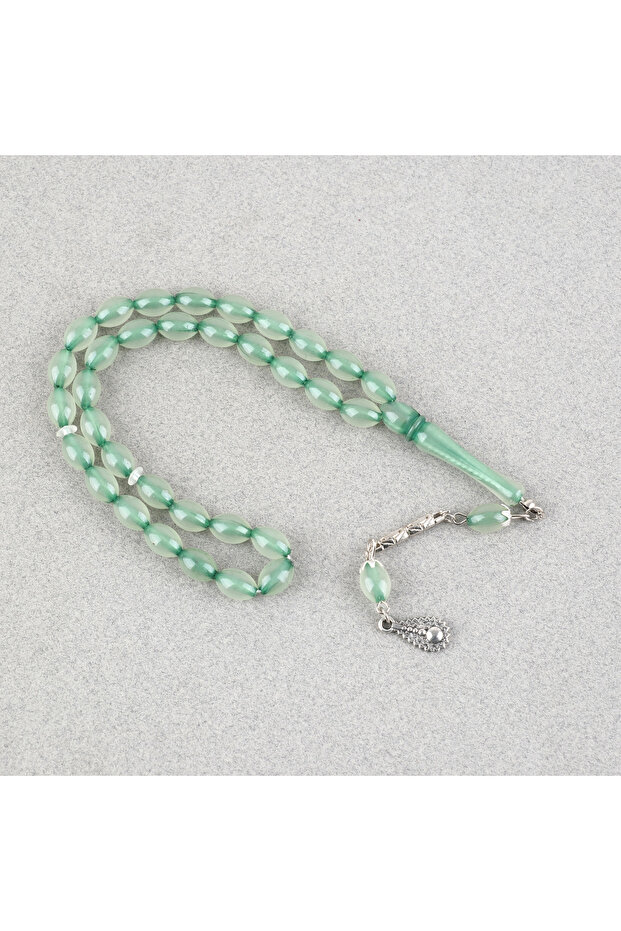 Glowing in the dark cat's eye alpaca tasseled white cut 7x11mm rosary-green