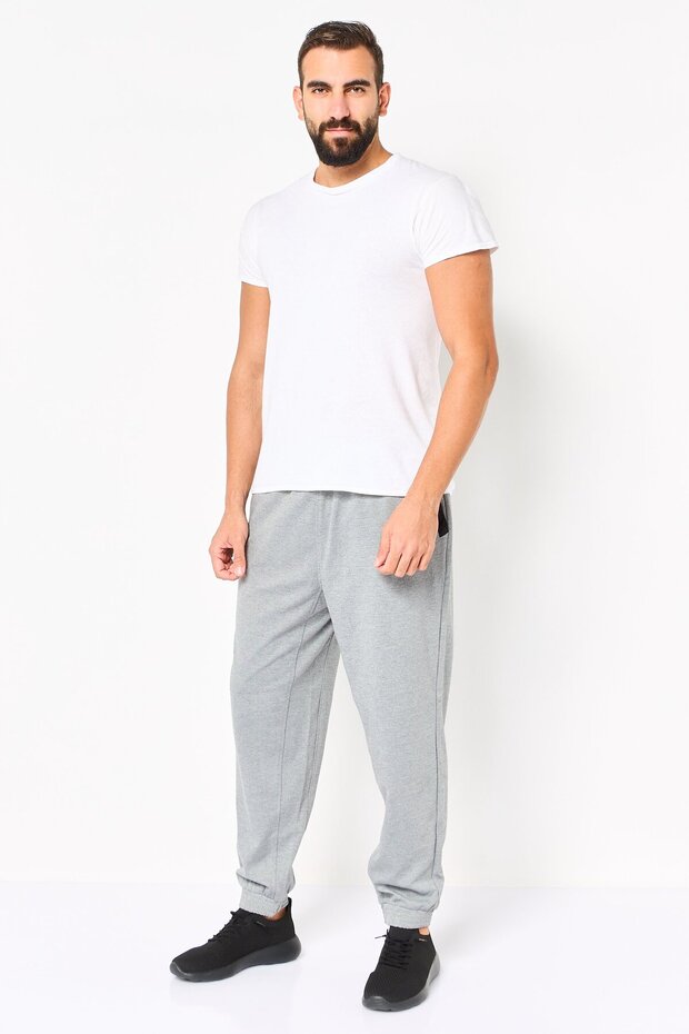 بنطال رياضي رجالي رمادي اللون، بقصة عادية، بلون موحد وقابل للتمدد. - 2