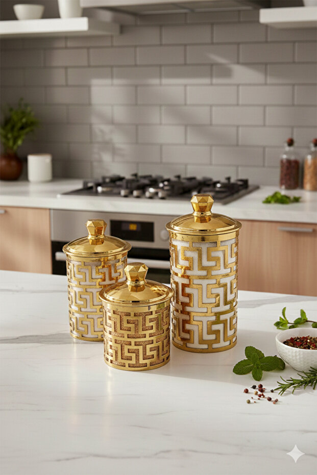A set of three different-sized acrylic containers for storing spices, legumes, and sugar, in a gold color.