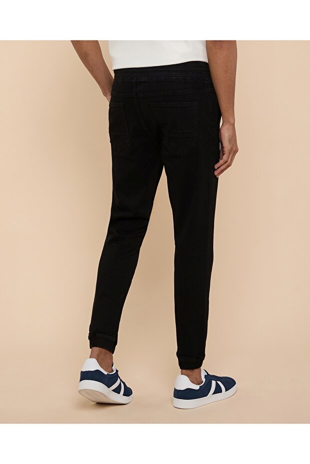 بنطلون جينز رياضي سادة بخصر برباط - 4