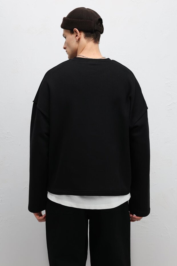 سترة رياضية أساسية ذات قصة فضفاضة باللون الأسود - 5