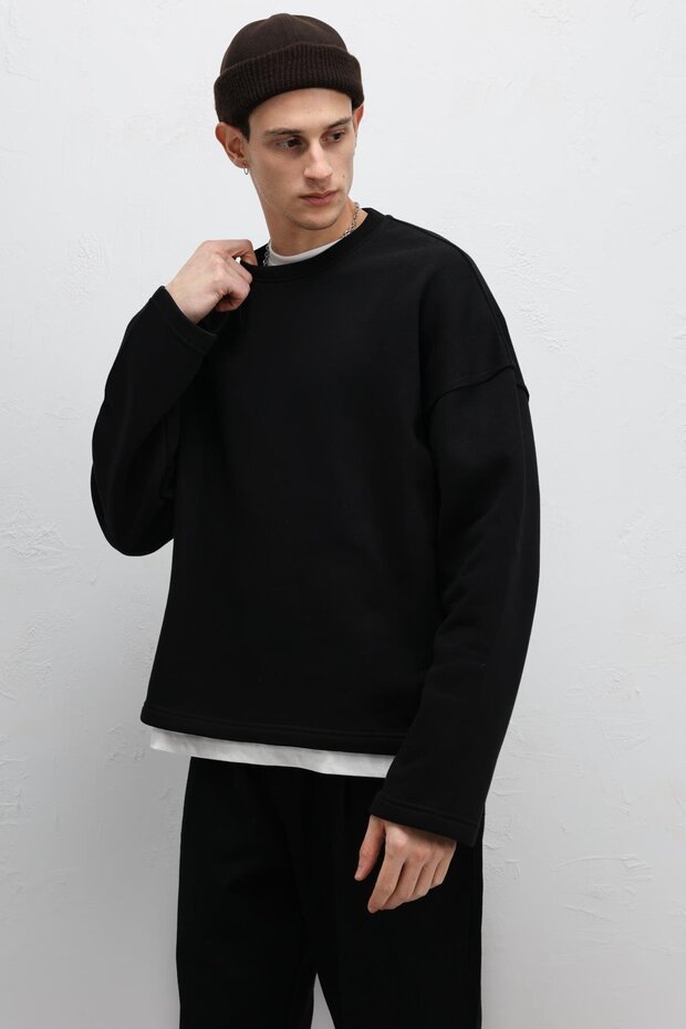 سترة رياضية أساسية ذات قصة فضفاضة باللون الأسود - 2