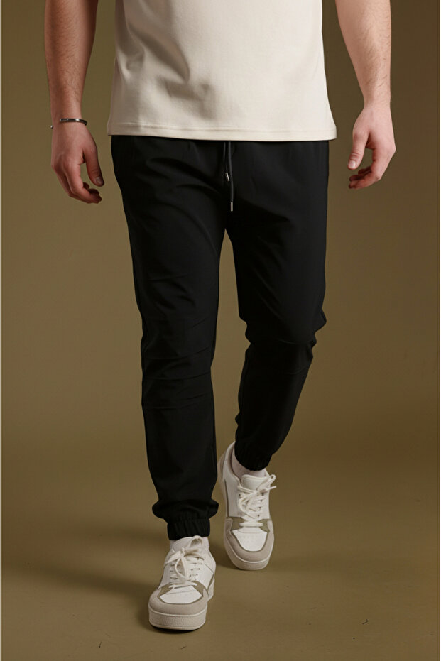 Men's Black Parachute Fabric Sweatpants | Sports Model with Elastic Cuffs, Zipper and Back Pocket