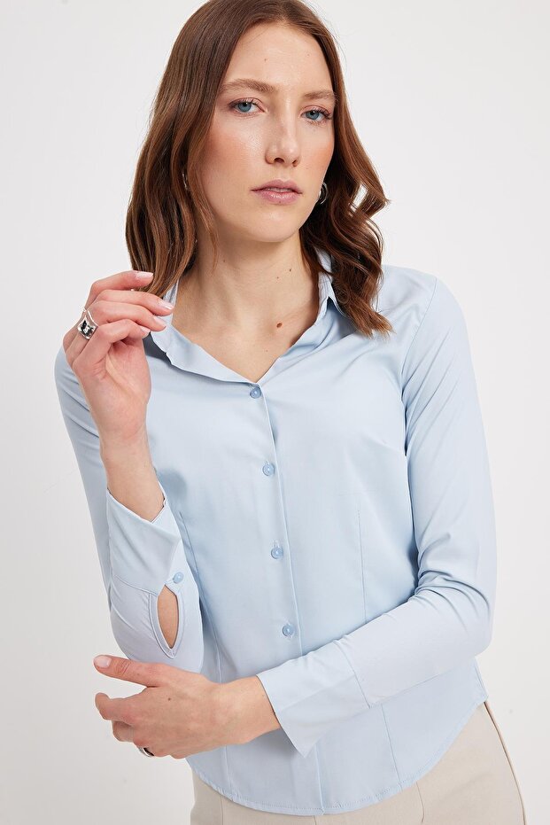Women's slim fit, body-hugging, classic collar, long sleeve, blue lycra shirt with darts.