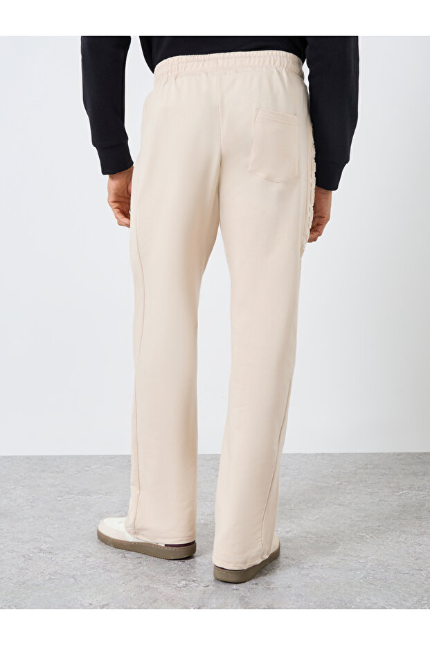 بنطال رياضي رجالي بيج سادة منقوش - 4