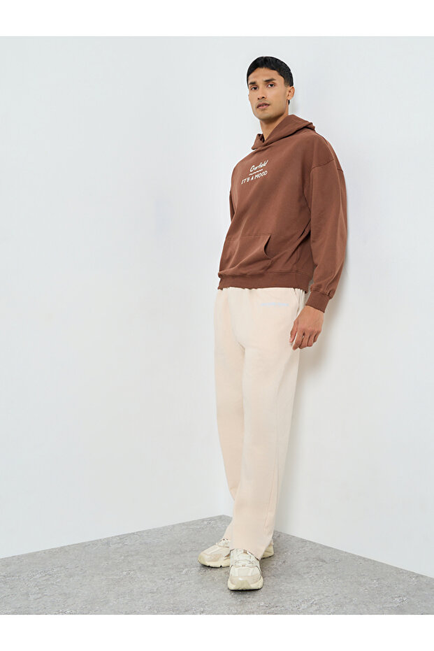 بنطال رياضي رجالي بيج فضفاض من قماش تيري