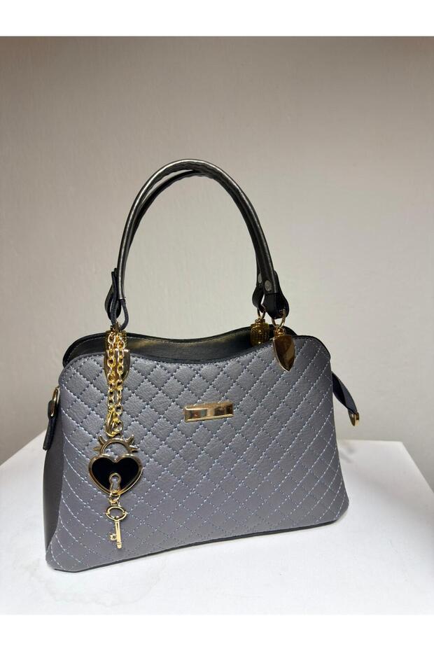 Women's Quilted Hand and Shoulder Bag with Gold Heart Key Accessory and Adjustable Strap