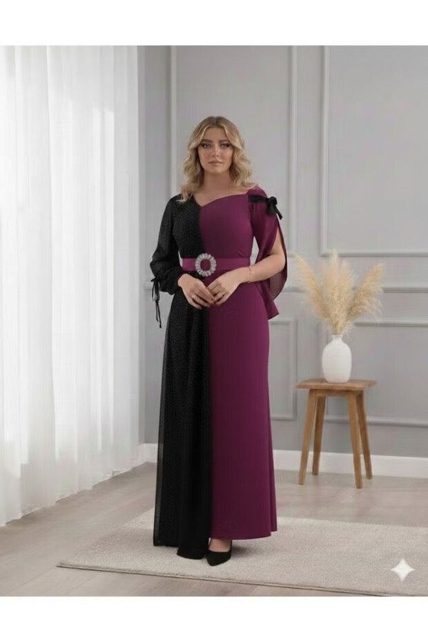فستان سهرة طويل أنيق بتصميم عصري يجمع بين الأناقة والتميّزبتصميم ثنائي اللون مما يضفي لمسة فريدة