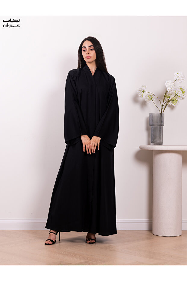Classic Nida fabric abaya featuring a front band and full button closure