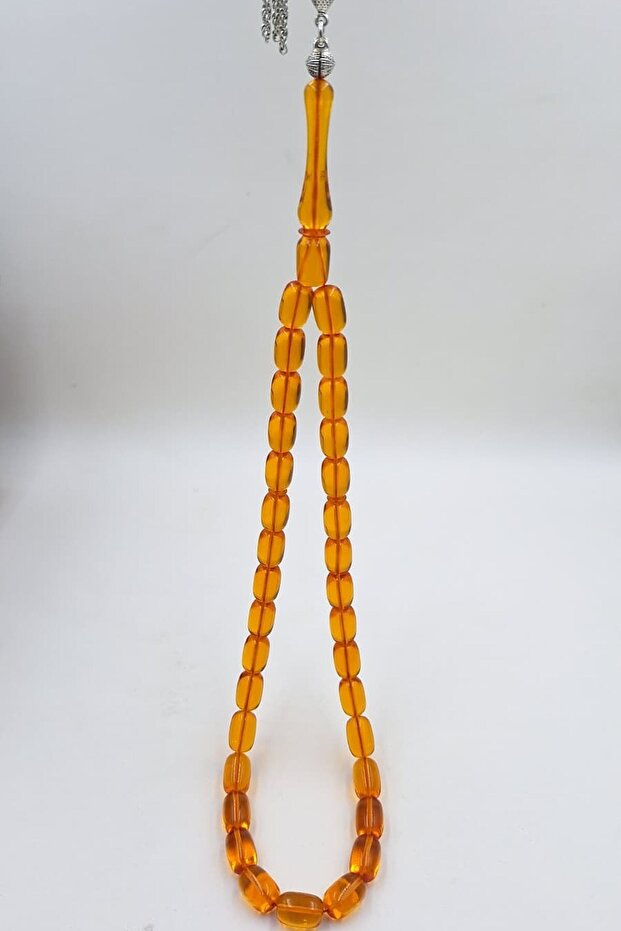 Transparent Orange Capsule Cut Amber Prayer Bead