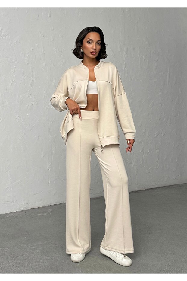 طقم نسائي من قماش المودال الناعم باللون البيج ذو ملمس مميز ومقاس كبير