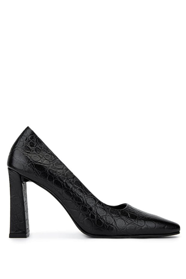 Woman's black patent leather high heeled shoe