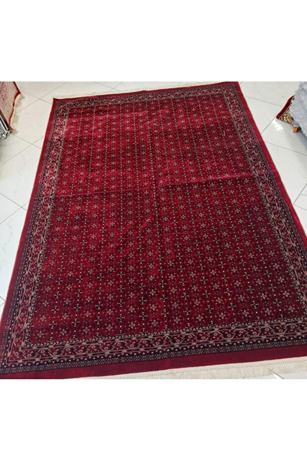 A rug with a traditional Afghan or Bukhari pattern