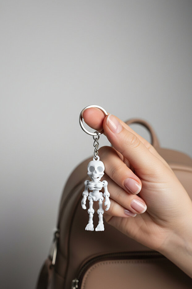 Smiling Skeleton Figured Movable Keychain White