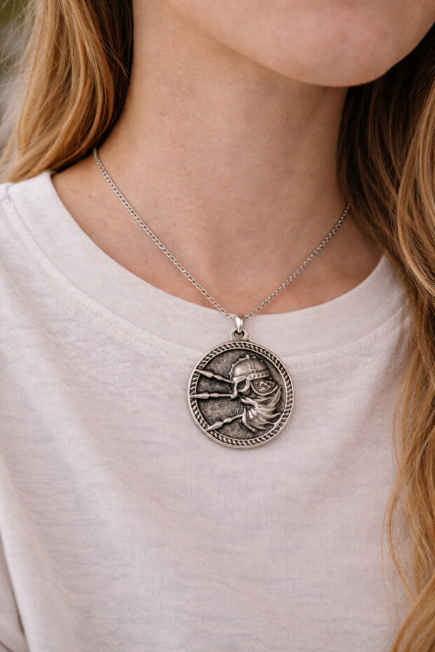 Round Medallion Shaped Metal Pendant with Figure Detail