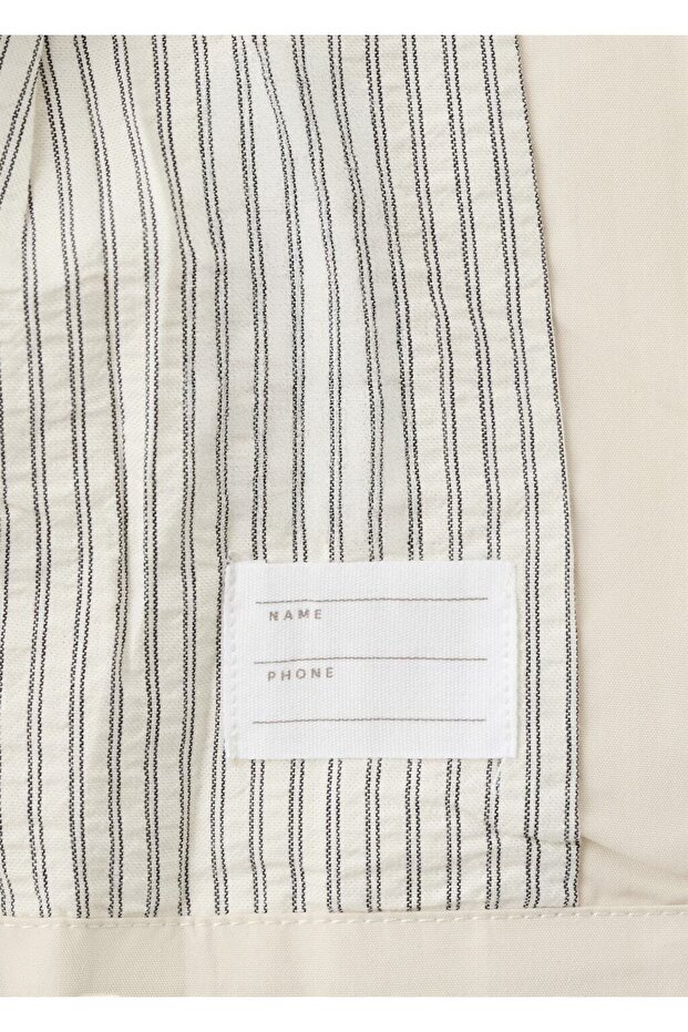 Rubberised jacket with bow - 6