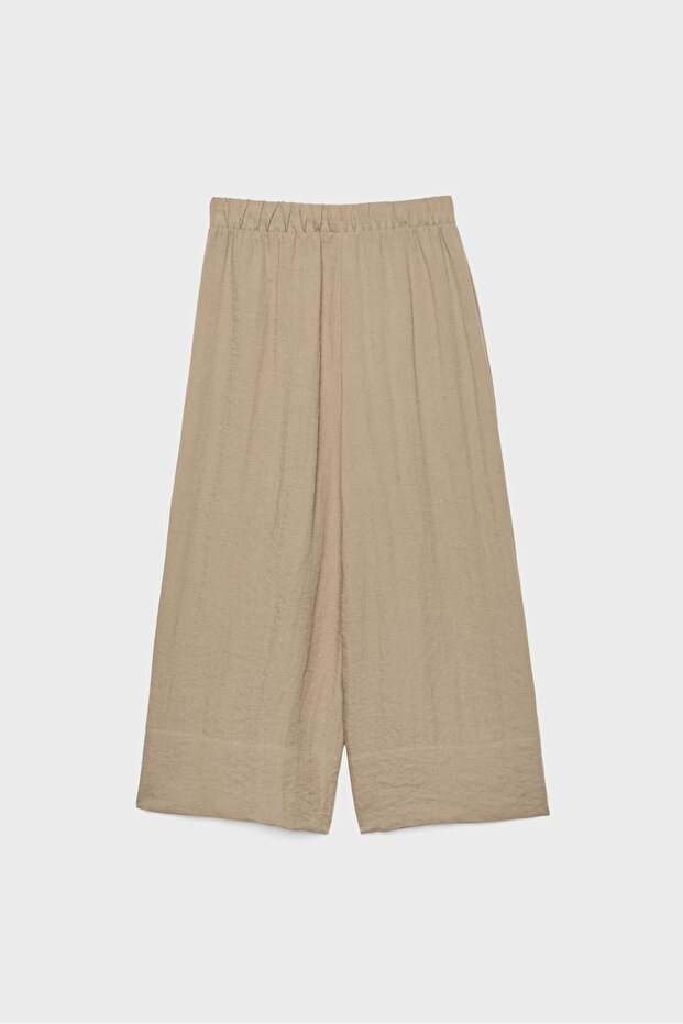 بنطلون واسع مزين بشرابات - 7