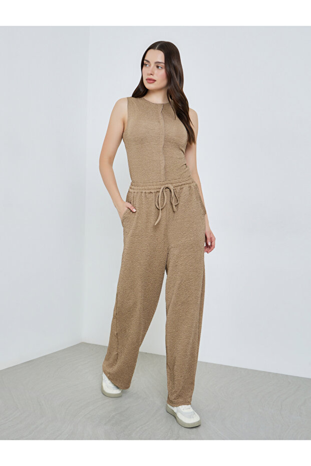 Women Beige Textured Wide Leg Trousers