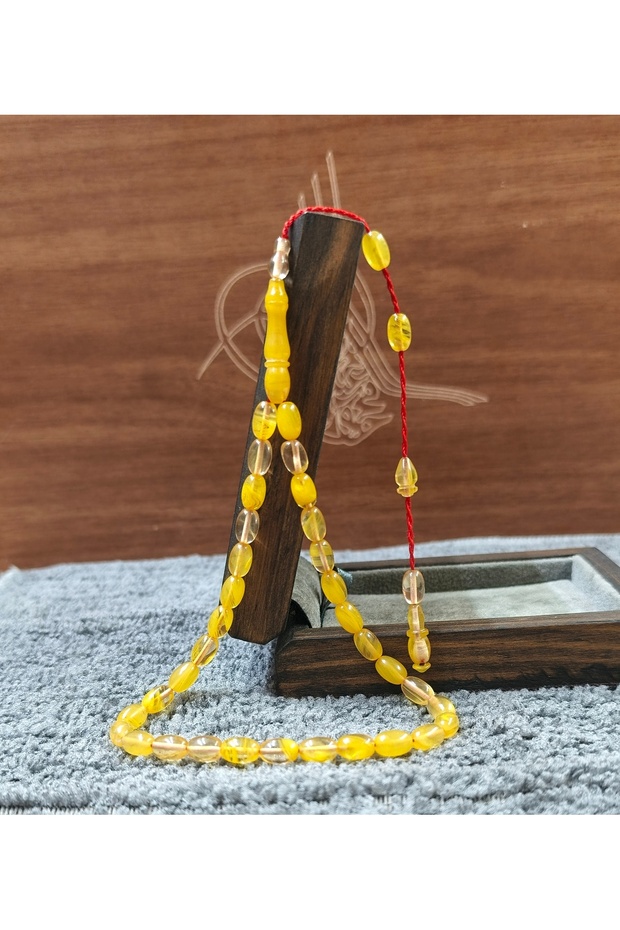 سبحة صغيرة الحجم بطول الكاحل مصنوعة يدويًا من حبات العنبر المقطوعة بحرفية عالية