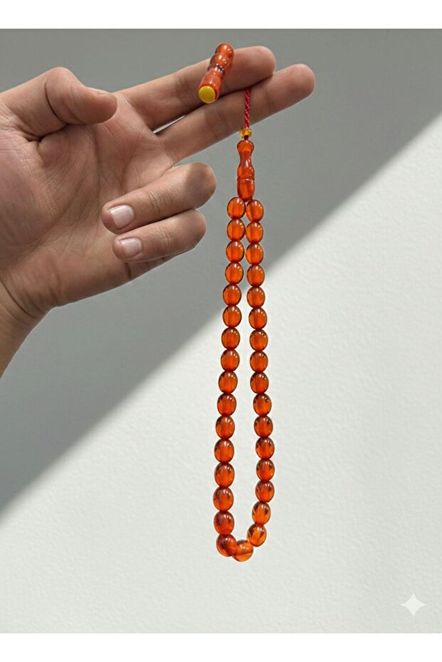 سبحة من خرز العنبر بلون ناري