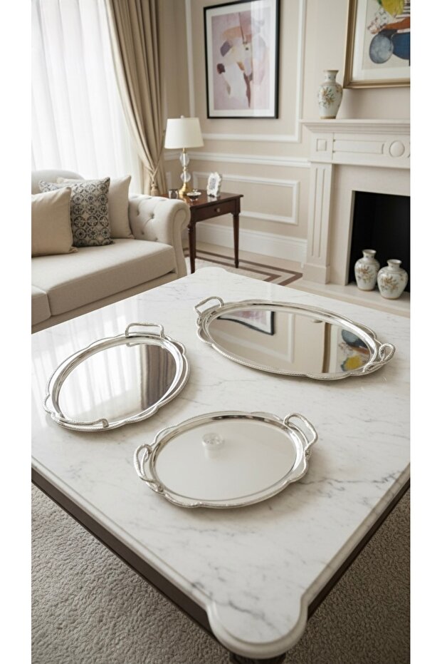 A luxurious serving tray set. A truly regal addition. Silver.
