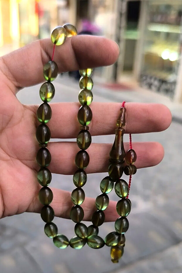 سبحة من العنبر الناري الأصلي مصنوعة يدويًا بنظام خاص ومزينة بالشرّابات