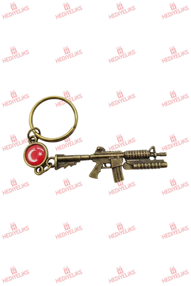 سلسلة مفاتيح هدية ذات طابع ذهبي مع شكل سلاح M16 CS