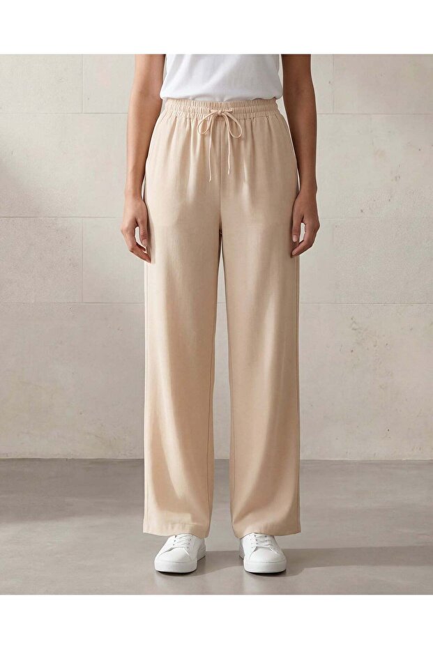 Women Beige Solid Trousers