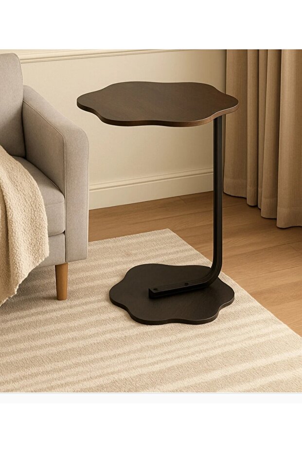 A stylish and modern side table with a rose-shaped top, perfect for living rooms and coffee shops.