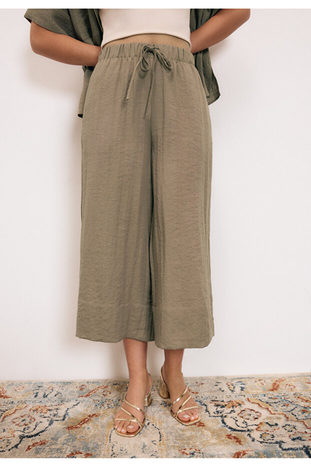 بنطلون واسع مزين بشرابات - 1