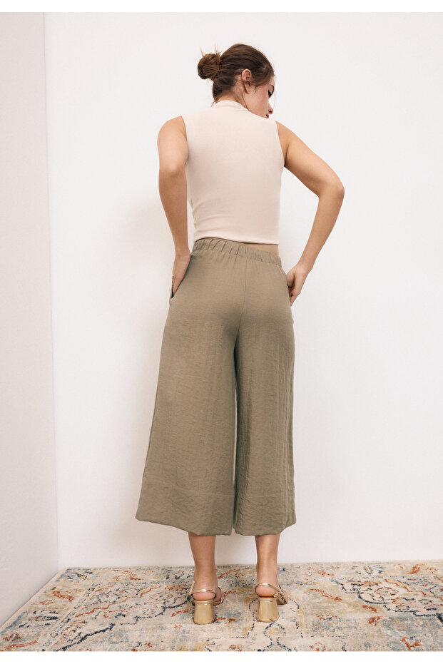 بنطلون واسع مزين بشرابات - 5