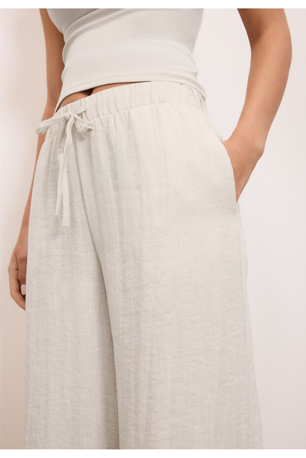 بنطلون واسع مزين بشرابات - 4