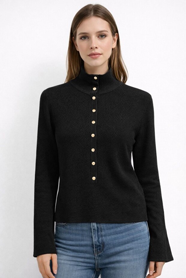 Women's black knit sweater with stand collar and gold snap detail