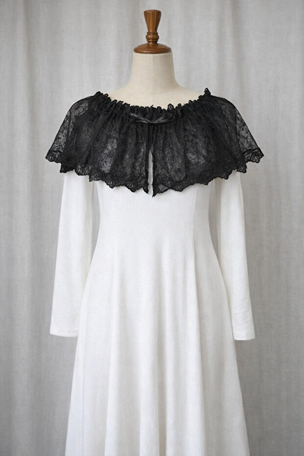 Elegant Model with Black Lace Collar