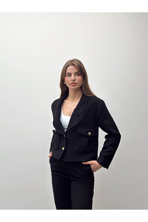سترة من مزيج الصوف الأسود من نوع التويد