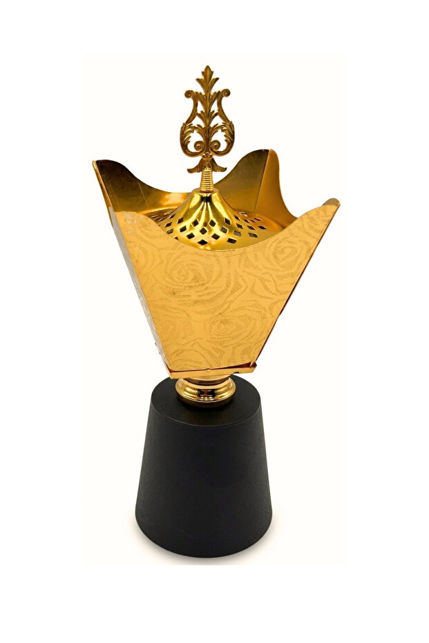 A luxurious gold incense burner for Eid with a silver lid, adding elegance to the space.