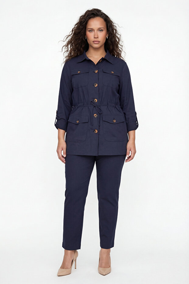 Women's navy blue summer dress with elastic waist, belt, and button detail.